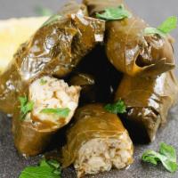 Stuffed Grape Leaves · Stuffed grape leaves with herbs and rice. Served with side of Tzatziki
