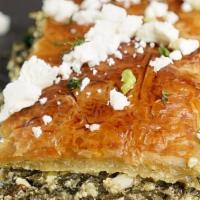 Spanakopita · Spinach Pie chopped spinach, feta cheese, onions & scallions, egg, and seasoning The filling...