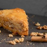Homemade Greek Baklava · Layers of butter brushed phyllo with ground nuts and cinnamon drizzled with a spiced honey s...