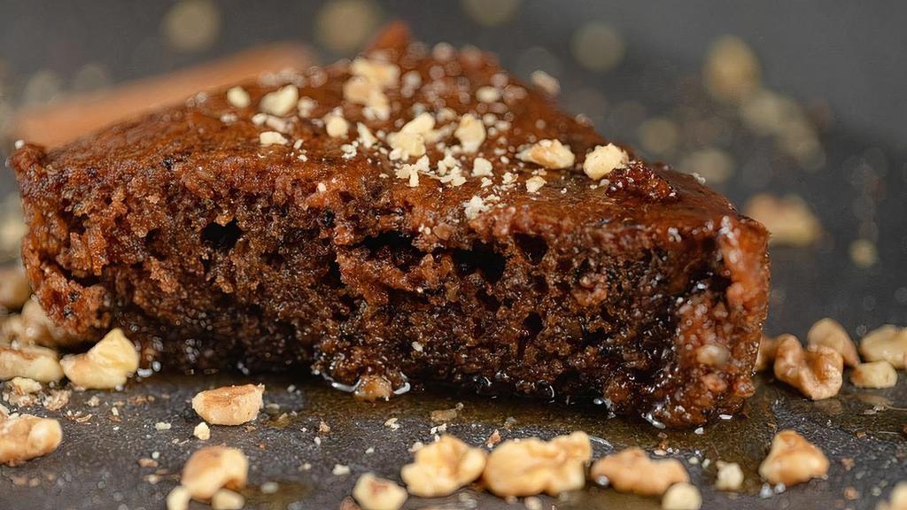 Walnut Cake (Karidopita) · A moist flavorful walnut cake that is flavored with cinnamon and bathed in sweet syrup.