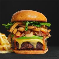 Fried Feast Burger · American beef patty topped with fries, avocado, caramelized onions, ketchup, lettuce, tomato...