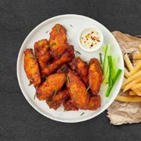 Classic Wings · Fresh chicken wings breaded and fried until golden brown. Served with a side of ranch or ble...