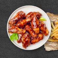 Chomp On Bbq Wings · Fresh chicken wings breaded, fried until golden brown, and tossed in barbecue sauce. Served ...