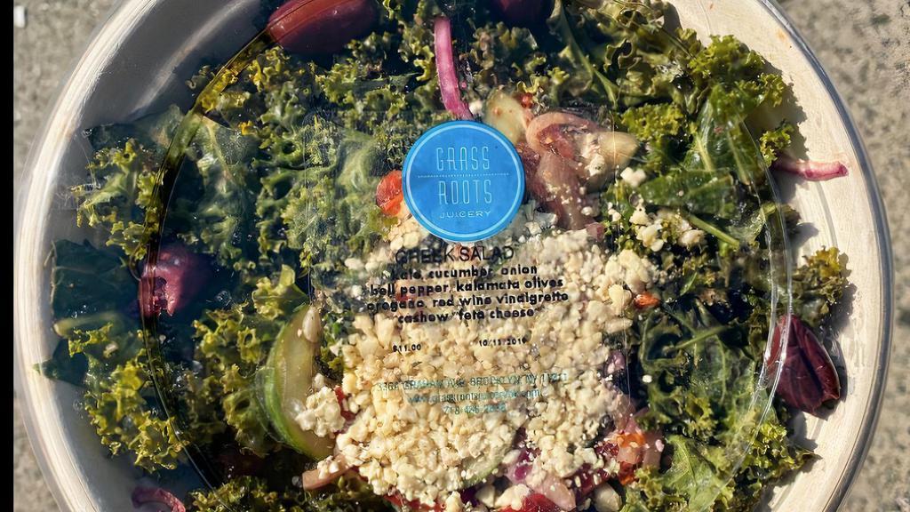 Raw Kale Greek Salad · Vegan, gluten free. Cashew feta cheese, cucumber, red onions, red pepper, olives and red white vinegar.