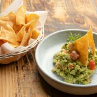 Guacamole · The freshest Guac, homemade corn chips and ONE side of  salsa borracha (made with dark Mexic...