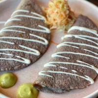 Steak Quesadillas · Order of two: Handmade organic blue corn tortillas with grass fed marinated grilled skirt st...