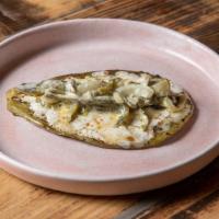 Nopal Asado · Grilled cactus topped with oaxacan cheese and rajas con crema 