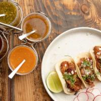 Tacos De Carne Asada · Marinated grilled skirt steak, onion and cilantro.