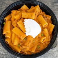 Pasta Alla Bolognese · Fresh ground beef and peas with tomato sauce and a touch of heavy cream topped with ricotta ...