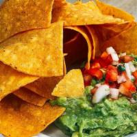 Homemade Guacamole & Chips · Made daily using perfect hass avocados from Mexico.