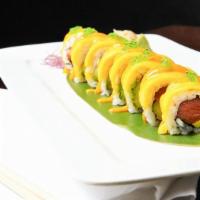 Mango Hawaii Roll · Inside: fresh salmon and avocado. On top: sliced mango with spicy mango sauce and wasabi tob...