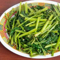 Stir-Fried Ong Choy · Add Cake Noodle for an additional extra charge.