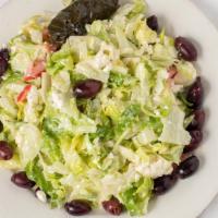 Our Famous Greek Salad · feta cheese, black olives, tomatoes, cucumbers & grape leaves mixed in our homemade greek dr...