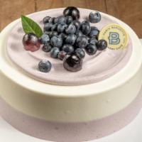 Blueberry Yogurt Cake · 3 Layer Vanilla Cake, Blueberry Yogurt Cream Filling with Strawberry. Contains: Egg, Milk, S...