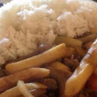 Lomo Saltado · (Choice: Beef or Chicken). Juicy French fries stir-fried with onions, tomatoes, cilantro and...