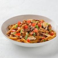 Cajun Chicken Penne  · Grilled chicken tossed with penne pasta, Applewood-smoked bacon and Chile-Asiago cream sauce...