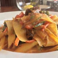 Pappardelle Primavera · Wide pasta served with seasonal vegetables in a creamy tomato sauce.