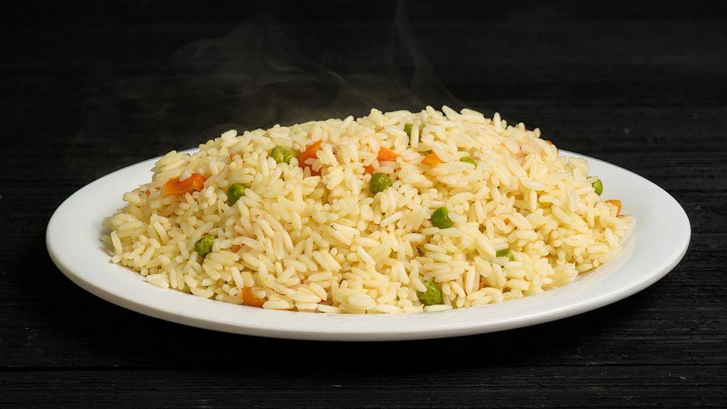 Rice Pilaf · Greek rice mixed with peas and carrots