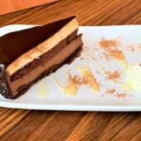 Chocolate Temptation Cake · FOUR Layers Chocolate Cake filled
with Chocolate Cream, Hazelnut Cream and Crunch, finish wi...