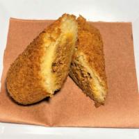 Yucateca Rellena · Deep Fried YUCA (CASSAVA) Dough , filled with a tasty spiced Beef & Pork meat mixture.
Bola ...