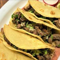 Tacos Bistec  / Grilled Steak · Bistec a la plancha marinado y sazonado con especias mexicanas. / Grilled steak marinated an...