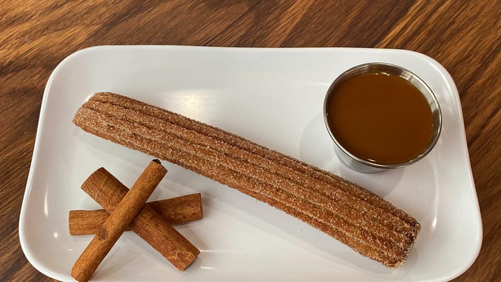 Churro Loco · Fried Mexican dough dusted with cinnamon and sugar stuffed with dulce de leche.