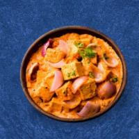 Cottage Cheese Tikka Mania · Cottage cheese cubes grilled prepared in thick onion, tomato and cream gravy. Served with si...