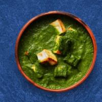 Spinach Cottage Cheese Showdown · Cottage cheese cooked in spinach curry with spices and onion, garlic and tomato. Served with...