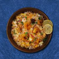 Shrimp Bayside Biryani · Aromatic rice flavored with shrimp, fragrant with saffron, garnished with raisins and cashews