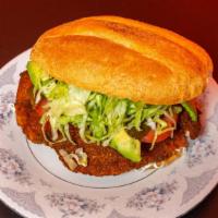 Pollo Asado Torta · Grilled Chicken, Topped with Lettuce, Tomato, Avocado, Jalapeño, Oaxaca Cheese, Refried Bean...