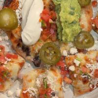 Temerario Nachos · Corn chips, avocado, sour cream, chihuahua cheese, beans crema, pico de gallo, pickled jalap...