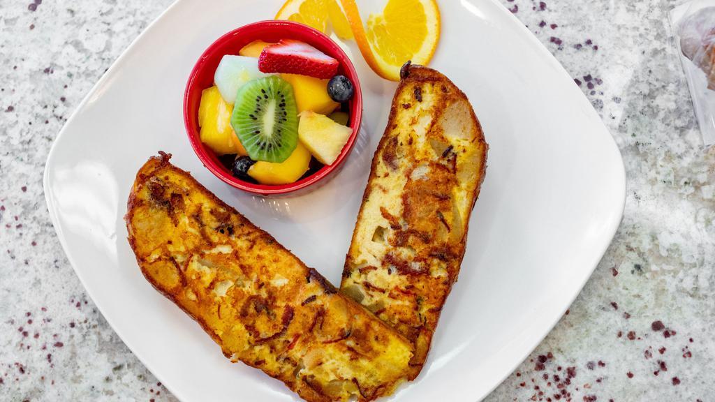 Frittata · Idaho potatoes, double-cut bacon, eggs, and creamy fontina cheese, served with a side of fruit or salad.