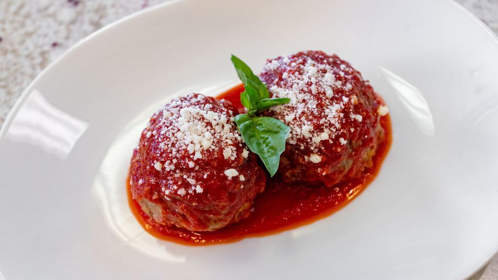 Meatball Parmigiano · Homemade meatballs prepared with our special blend of finely chopped meats simmered in our signature tomato sauce and topped with fresh mozzarella.