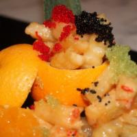 Rock Shrimp Tempura · Breaded fried shrimp served with fresh orange in tangy sauce, top seller.