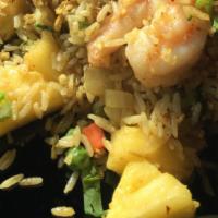 Pineapple Fried Rice With Shrimp · Fresh pineapple, jumbo shrimp, peas carrots, onions, egg with curry spice.