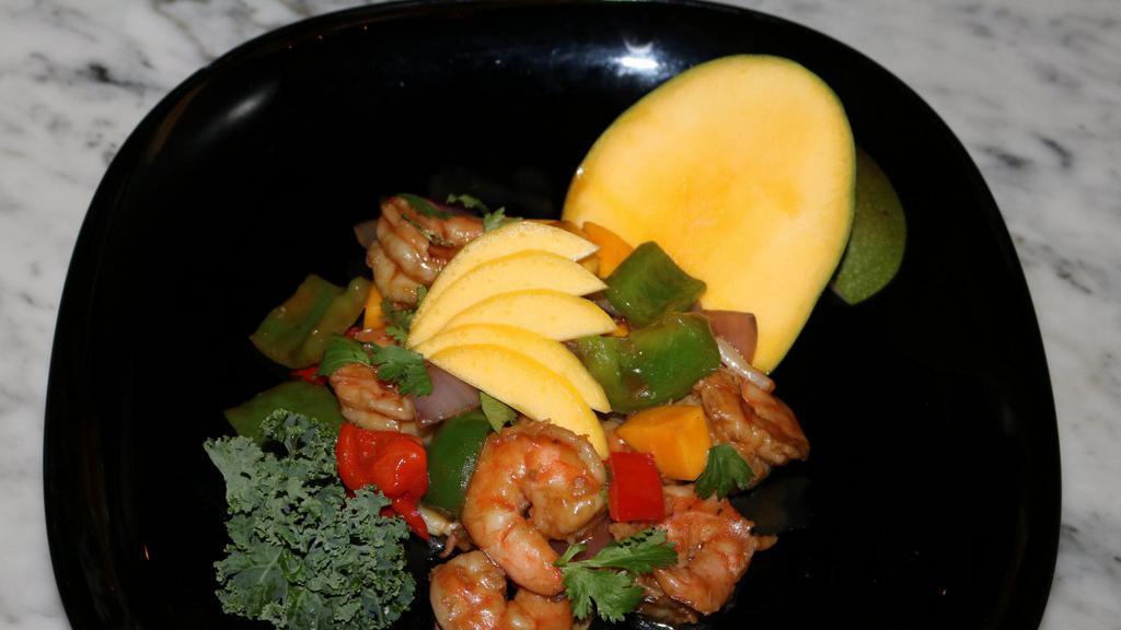 Mango Shrimp · Sautéed shrimp with asparagus, red and green peppers, mango, onion and cilantro in mango sauce.