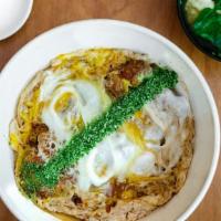 Katsu Don · Deep fried Japanese corn-fed pork cutlet, onion, egg rice bowl. Served with soup, pickle.