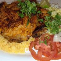 Pork Chops · Center cut pork chops served with rice or French fries and salad.