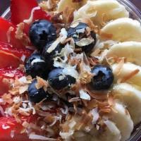 Acai Bowl · Acai base topped with granola, honey, sliced bananas, strawberries, blueberries, and toasted...