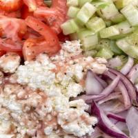 Greek Salad · Iceberg lettuce with chopped tomato red onion diced cucumber feta cheese and your choice of ...