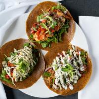 Trio Timeless Tacos · 1 of each of our 3 tacos, served in one dish! Original, Curry Mango, and SPicy Jack. Yum!