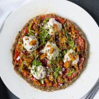 Classic Plantiful Pizza · Marinara sauce and cashew cheese adorning a buckwheat and sunflower crust. Topped with red o...
