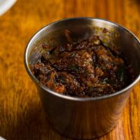 Daata  · Ethiopian Hot Sauce. Cilantro, Berbere, Garlic, Peppers & Oil.