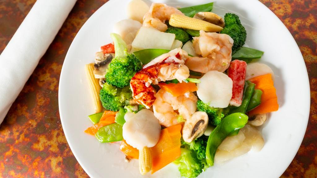 Seafood Combination · Combination of lobster meat, jumbo shrimp, crab meat & scallops mixed with straw mushrooms, baby corn, chinese veg. & broccoli.