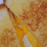 3 Cheeses Grilled Cheese Sandwich · A blend of American, cheddar and swiss cheese served on artisan brioche bread.