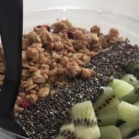 Blue Magic Bowl · Banana, blueberry and spirulina powder. Topped with granola, chia, sliced almonds, and kiwi.