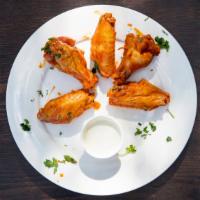 Buffalo Wings · Hormone-free jumbo party wings served with your choice of blue cheese or ranch dipping sauce...