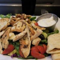Grilled Chicken Salad · Lettuce, tomato, cucumber, pepper, olives, artichokes and green apple.