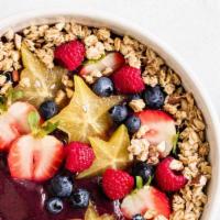 Berry Bowl · Organic acai blended with strawberry, blueberry, banana and almond milk. Topped with granola...