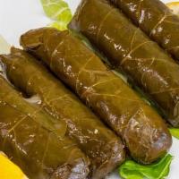 Stuffed Grape Leaves · The grape leaves stuffed with rice, extra virgin olive oil, pine nuts, and raisin.